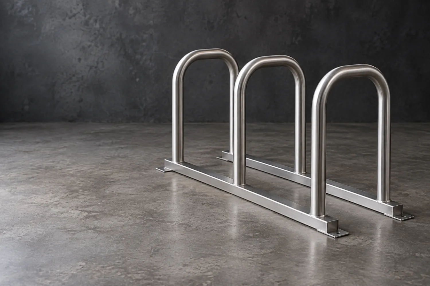 Concept illustration of a stainless bicycle parking rack with three inverted U hoops on base rails