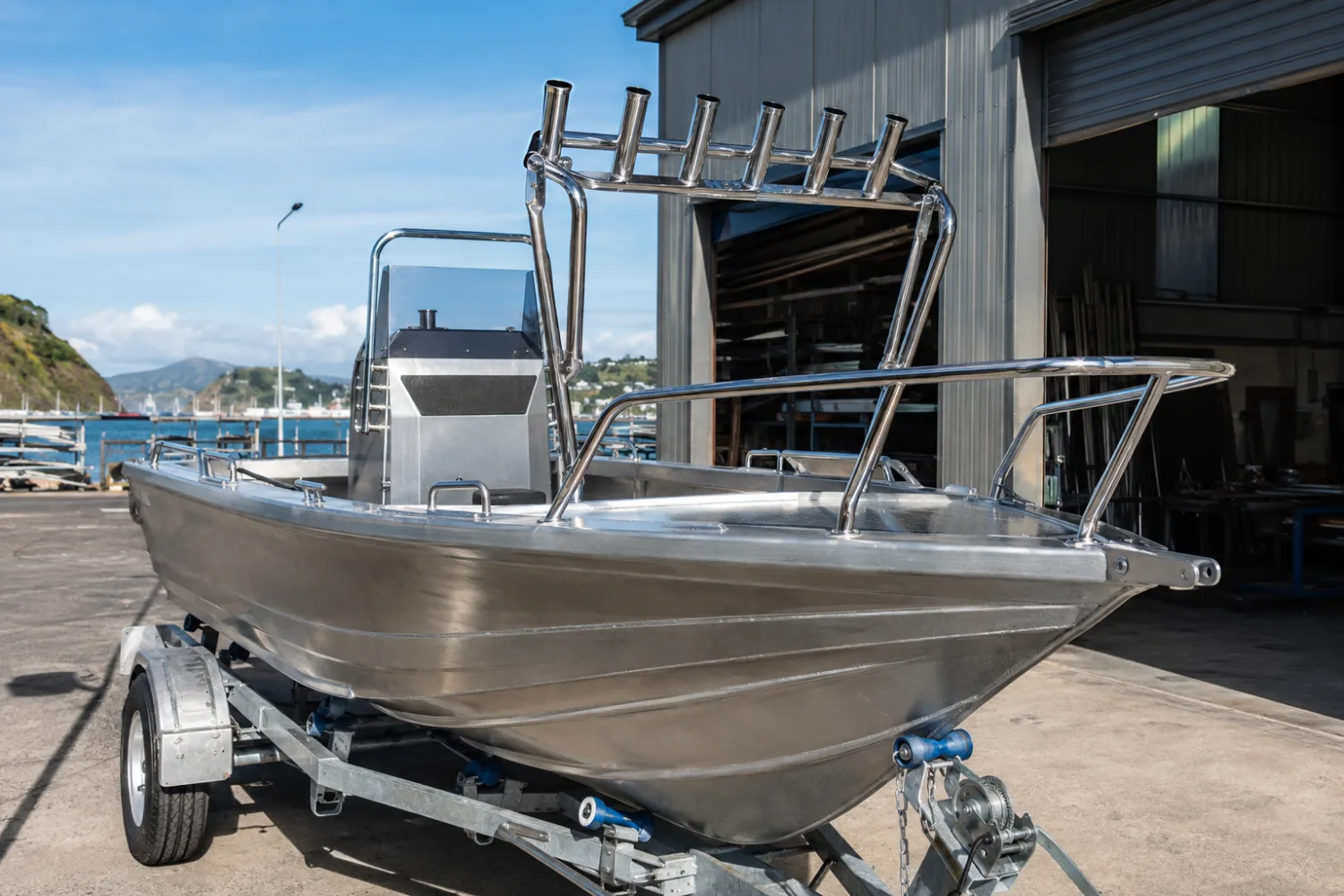 Custom polished 316 stainless steel bow rail and rocket launcher on a fishing boat, fabricated by Specialised Stainless