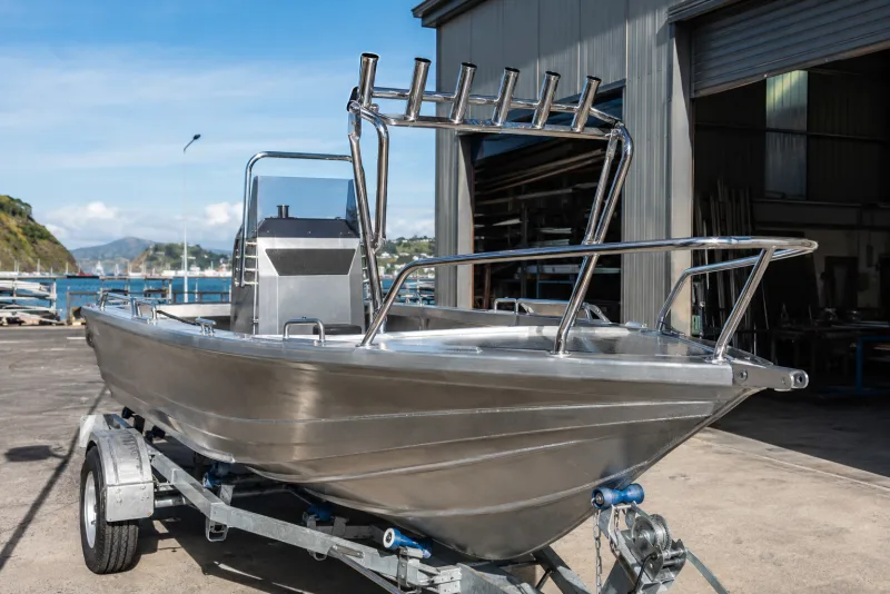 Custom polished 316 stainless steel bow rail and rocket launcher on a fishing boat